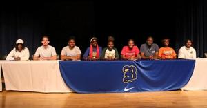 Brunswick High’s Titus Washington, Sebastian Hutchinson, Shakaylan Pinkston, Shamya Flanders, Dariana Johnson, JaMya West, Shane Jackson, Taniyah Battle and Camarion Johnson pose for a photo during a signing ceremony.