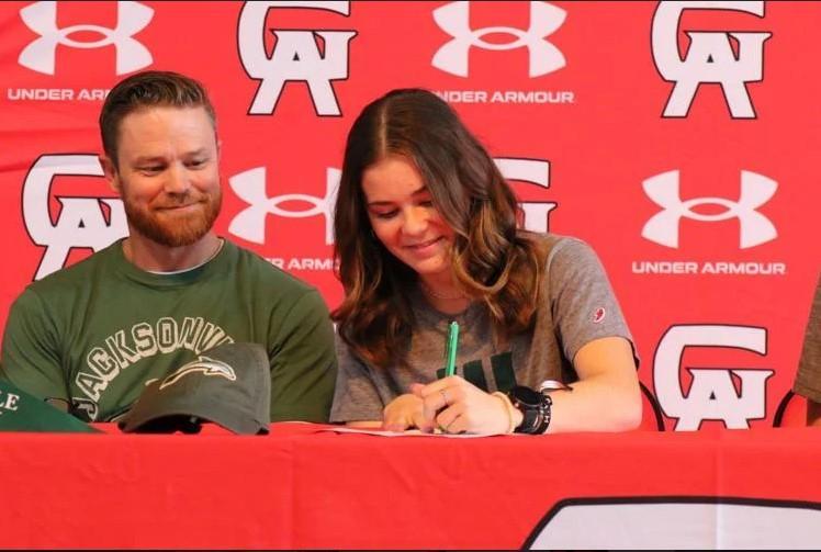 Glynn Academy\'s Isabella Albright signs her letter of intent during a signing ceremony.