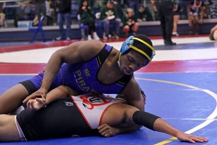 Brunswick High\'s Blake Etheridge wrestles Glynn Academy\'s Jakob Brooks at the Port City Memorial last Saturday.