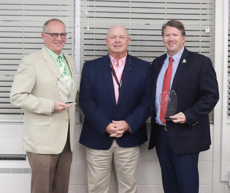 Jerry Mancil, left, Superintendent Scott Spence and Marcus Edgy.