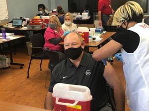 Dr. Scott Spence receives COVID-19 vaccine.