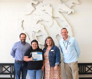 Glynn Middle School student Daniela Iturbide-Malone with school and district administrators.