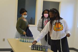 Golden Isles College & Career Academy students pack bags with hygiene products for local homeless veterans.