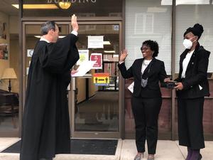 Audrey Gibbons is sworn in by Judge Stephen Kelley.
