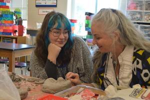 Tamara Daughtry, right, speaks with an art student during her class planning period. Daughtry’s years of experience using the online art education platform Artsonia has been especially beneficial this school year.
