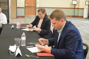 Ryan Moore and Suzanne Tilghman, judges in a GICCA culinary competition Tuesday, try one of the many dishes created by the students.