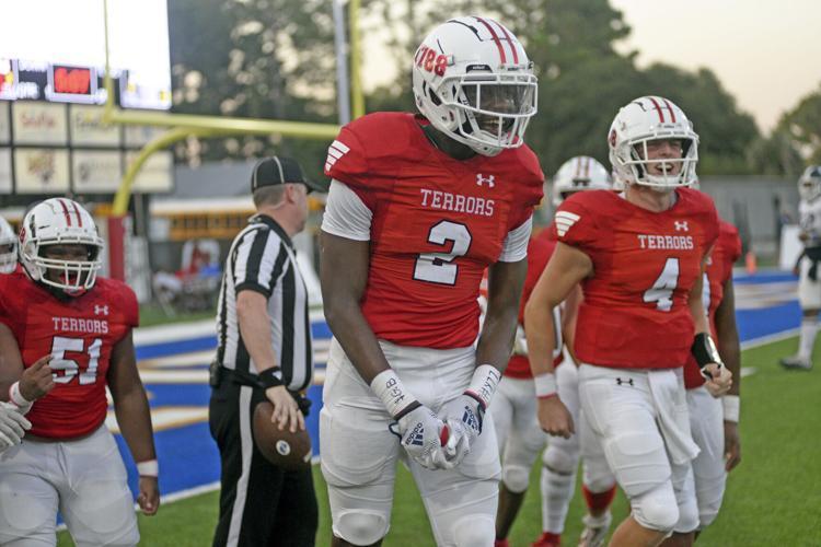 Glynn Academy\'s David Prince celebrates after his touchdown grab where the team opened the season with a 21-0 win.