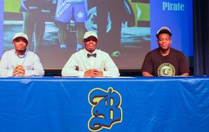 Brunswick High\'s Cameron Crump, left, Jeremiah Dawson, and William Abbott pose together after signing with Life University.