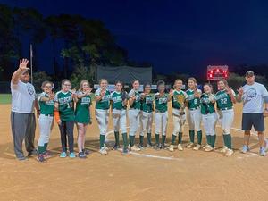 Members of the Risley Middle School softball team pose with the middle school championship trophy after winning the program\'s fifth consecutive title Oct. 27.