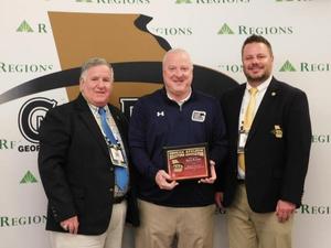 Steve Waters, middle, was named Athletic Director of the Year.