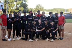 Glynn Academy celebrates with City Championship trophy after claiming the series against Brunswick High.
