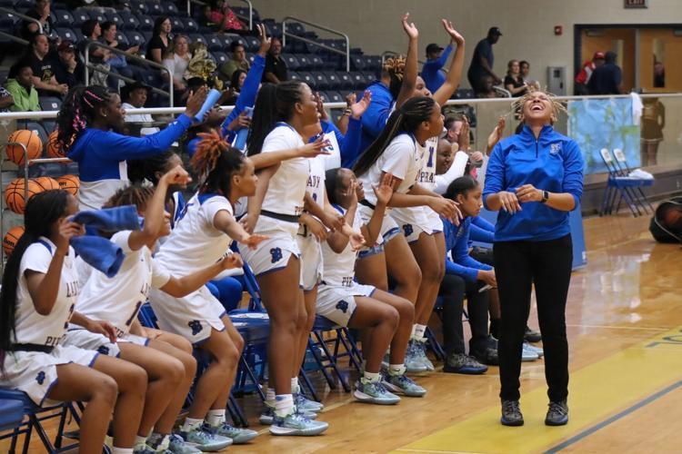Brunswick High girls head coach Maria Mangram and her team celebrate as the time winds down in a Class 6A quarterfinal game against Sequoyah at the Brunswick Square Garden.