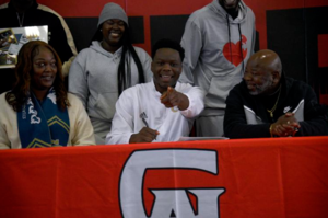 Glynn Academy\'s David Prince signs on to play football at Georgia Tech on Wednesday at the Terrors\' athletic fieldhouse.
