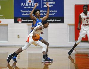 Glynn Academy\'s Quay Dickens drives against Brunswick High during the City Championship on Saturday at The Glass Palace.