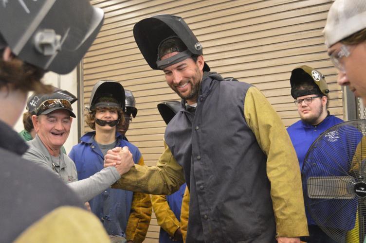 Professional baseball player and Glynn Academy alumnus Adam Wainwright shakes hands with Mike Benson, the welding instructor at the Golden Isles College and Career Academy. Wainwright donated $20,000 to GICCA on Friday.