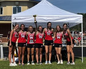 The Glynn Academy girls cross country team celebrates its first-place finish at the Peach State Preview 2023 last Saturday in Hazlehurst.