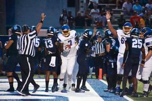 Brunswick High\'s Hezekiah Kent celebrates after scoring the first touchdown of the game against Camden in Kingsland.
