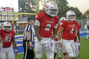 Glynn Academy\'s David Prince celebrates after his touchdown grab where the team opened the season with a 21-0 win.