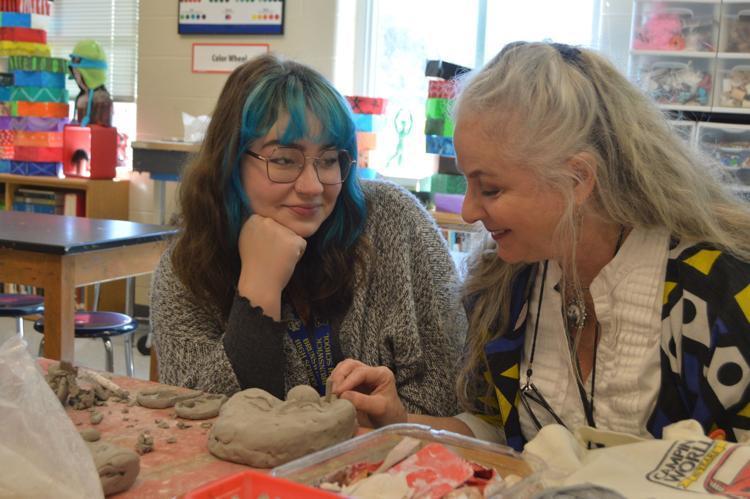Tamara Daughtry, right, speaks with an art student during her class planning period. Daughtry’s years of experience using the online art education platform Artsonia has been especially beneficial this school year.