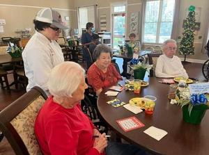 Students from the Golden Isles College & Career Academy hosted a Spring Fling Bingo event for residents of HomeLife on Glynco.