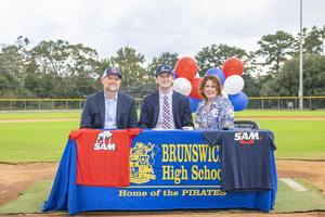 Brunswick’s Elijah Wellman is joined his parents as he signed he NLI to play college baseball at Samford University.