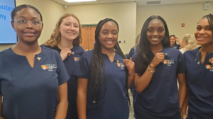 O’nisha West, from left, Abigail Harrison, Diasaya Cash, Kamaria Smith and Jamiah Taylor pose with their CNA pins.