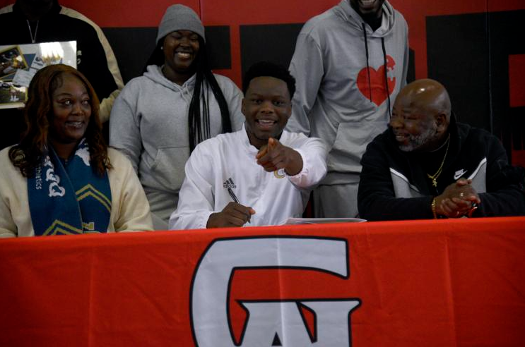 Glynn Academy\'s David Prince signs on to play football at Georgia Tech on Wednesday at the Terrors\' athletic fieldhouse.