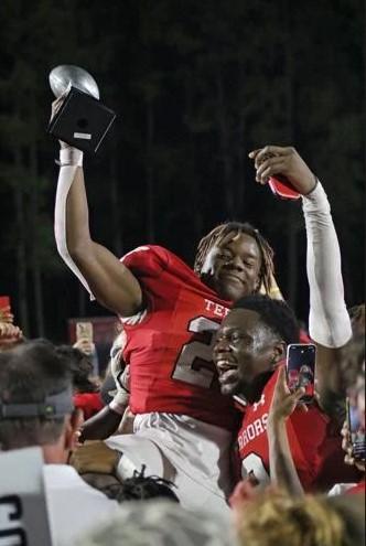 Glynn Academy\'s Jayden Ellis reacts after being named the Glynn County Sports Hall of Fame\'s Player of the Game at the City Championship at the Glynn County Stadium.