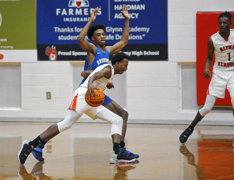Glynn Academy\'s Quay Dickens drives against Brunswick High during the City Championship on Saturday at The Glass Palace.