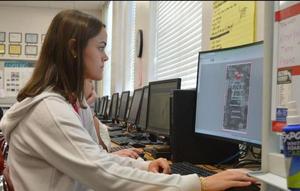 Miles Young, editor in chief for Glynn Academy\'s yearbook staff, works on this year\'s issue. The school\'s 2022 High Tide yearbook won a first-place ranking from the American Scholastic Press Association and was one of four to win \"Most Outstanding High School Yearbook\" in the nation.