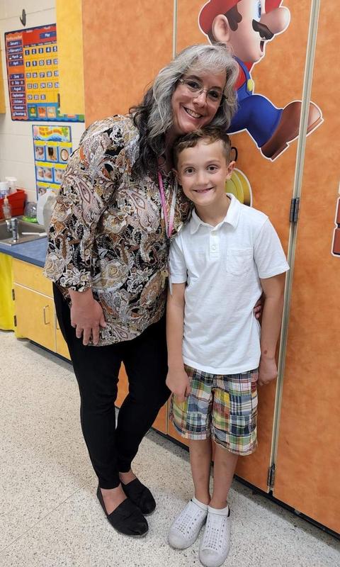 Mrs. Waters with a student.