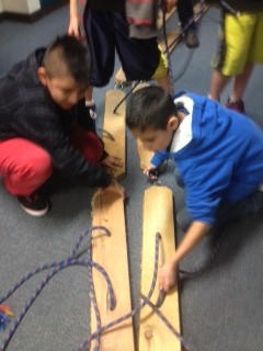 Students linking up land skis for a team event