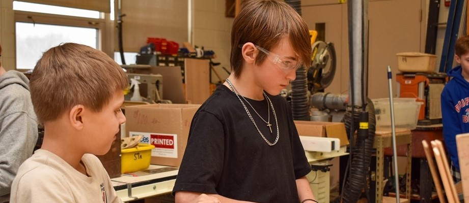 students working with tools in technology class