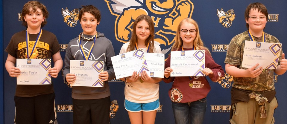 five older students holding certificates