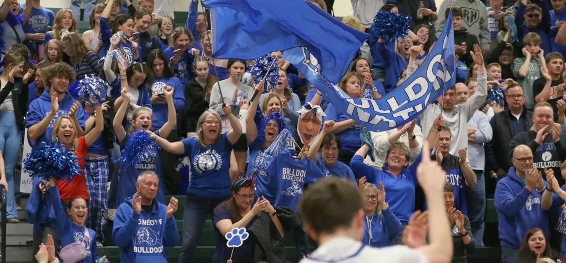 group of Honeoye fans cheering