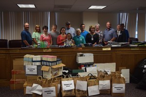 Those who donated at the school supply drive on August 29 stand with administrators of HCPS
