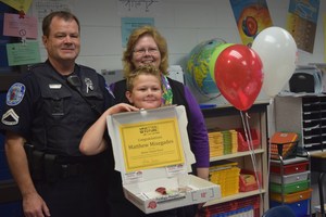 Matthew Misegades, a fifth grade student at Patrick Copeland Elementary, is all smiles as he stands with his parents after being named a Better Future Fund Winner on April 18.
