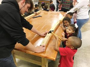 Carpentry students teach WLC students woodworking.