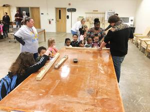 Carpentry students teach WLC students woodworking.