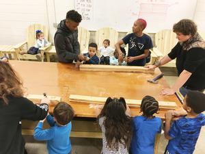 Carpentry students teach WLC students woodworking.