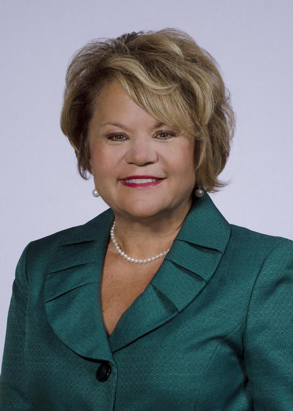 the image is of a headshot of Dr. Hackney, Superintendent of Hopewell City Public Schools, in a green suit top with a scalloped lapel