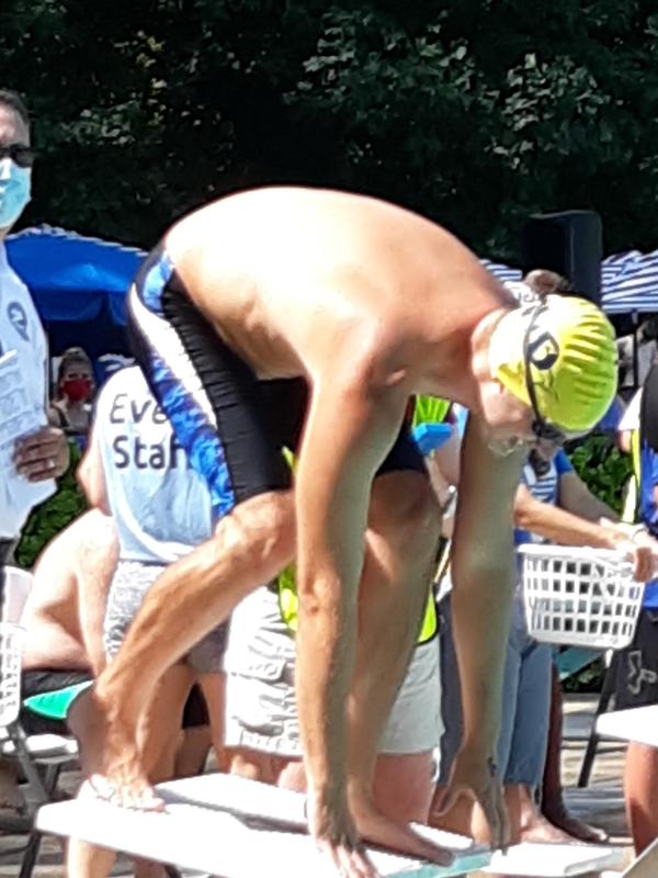 man diving into pool