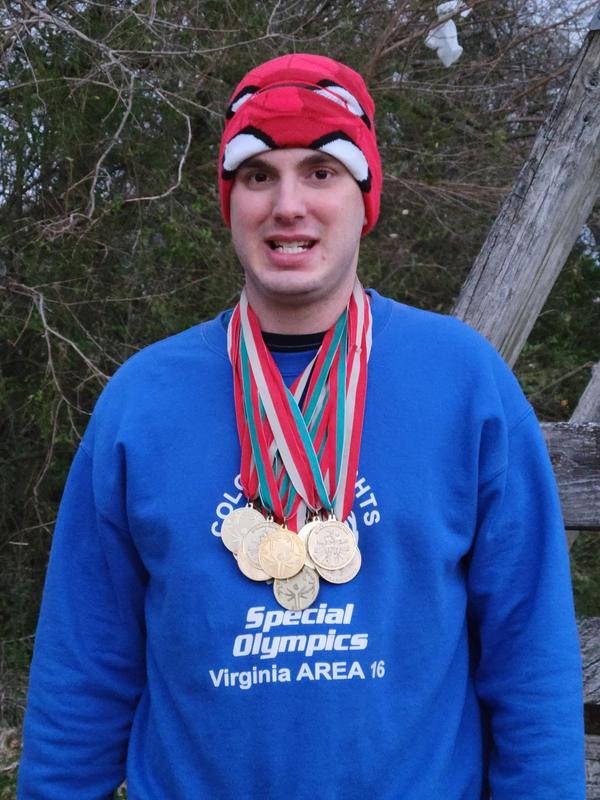 man with gold medals