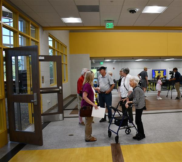 People stand in hallway