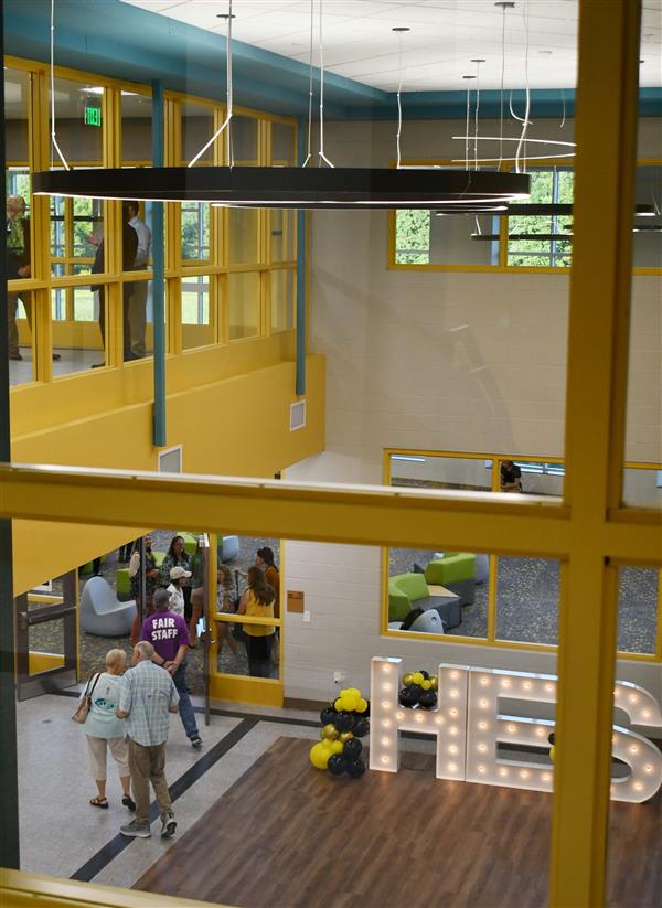 view of people on two floors through glass windows