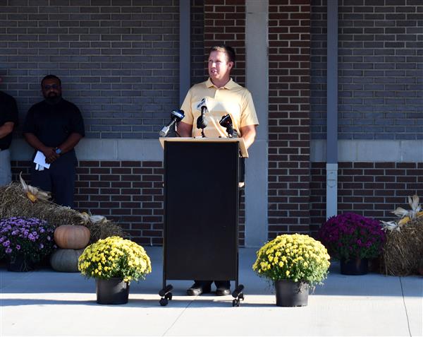 Man stands at podium