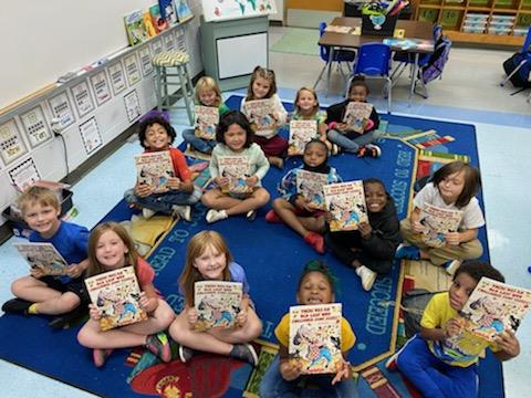 1st grade students appreciate the books given to them by the PTO.