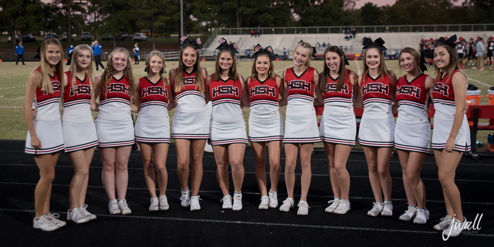 Varsity cheerleaders and Marty the Mustang performing at the Spring Park.