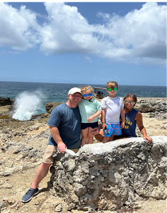 photograph of Sherwood principal Briana James and her family in Curacao during the summer 2024