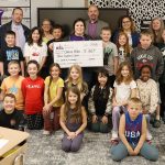 Volunteers with the Kearney School District Education Foundation present a $300 Teacher Innovation Grant to Chelsea Miller on April 11, 2025, at Hawthorne Elementary.